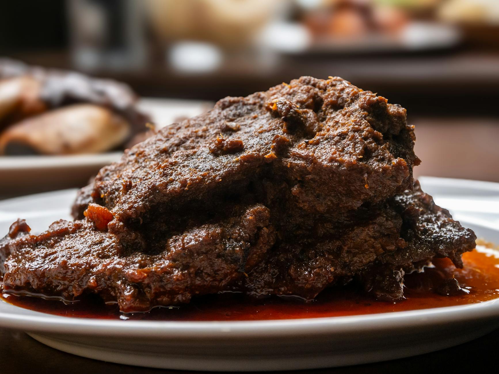 Plate of Indonesian rendang and rice dishes