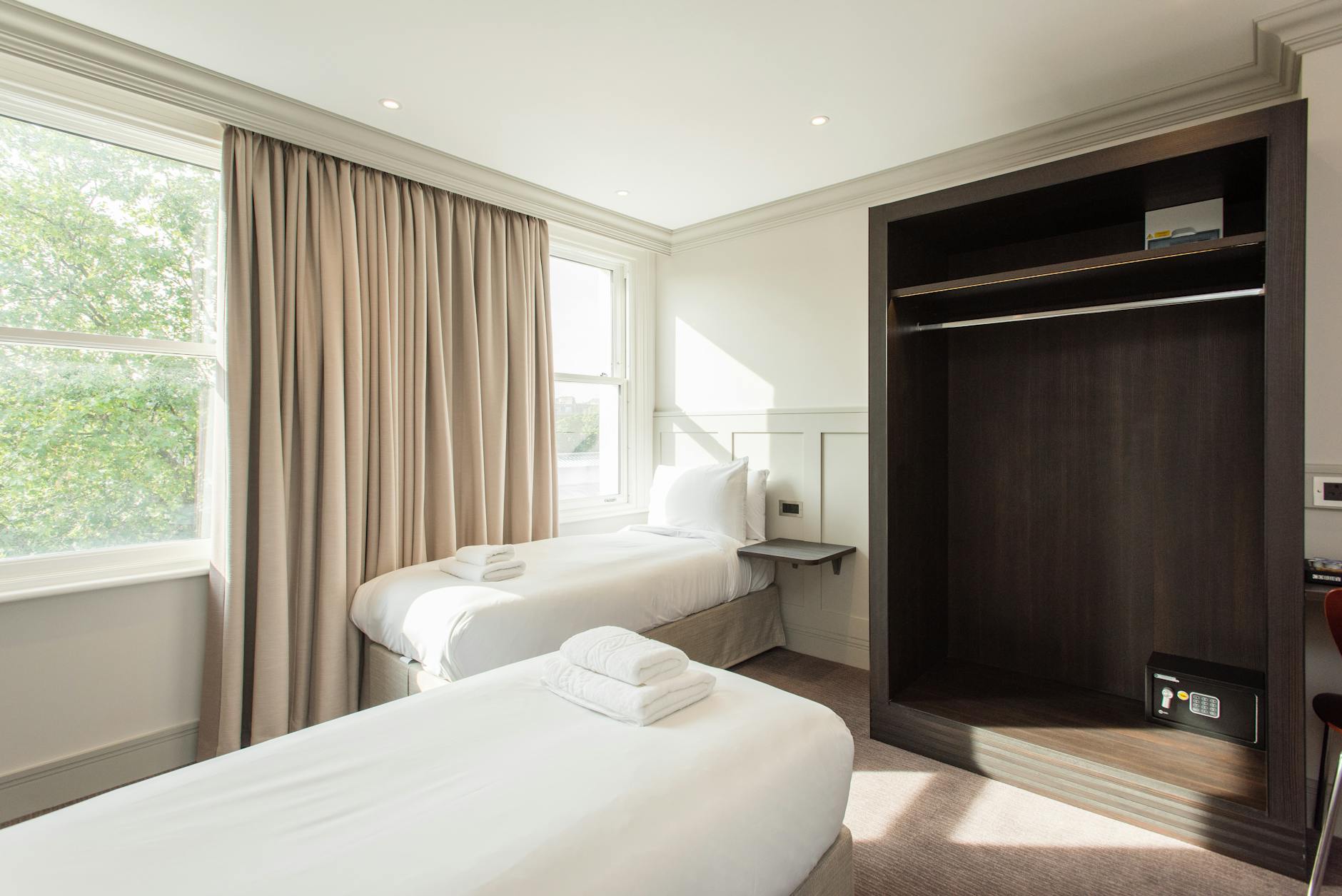Clean budget hotel room with simple modern design