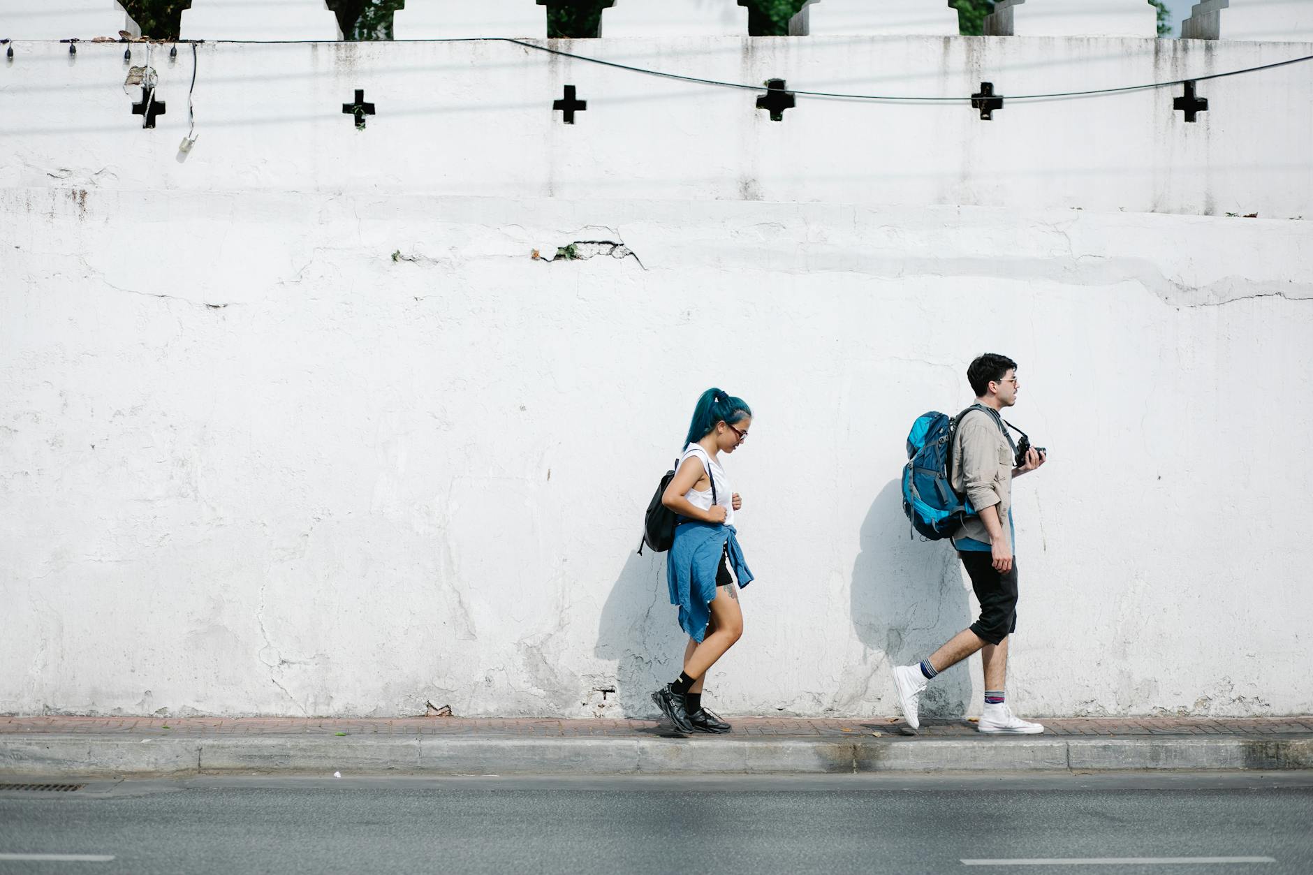 Young backpackers exploring a city street