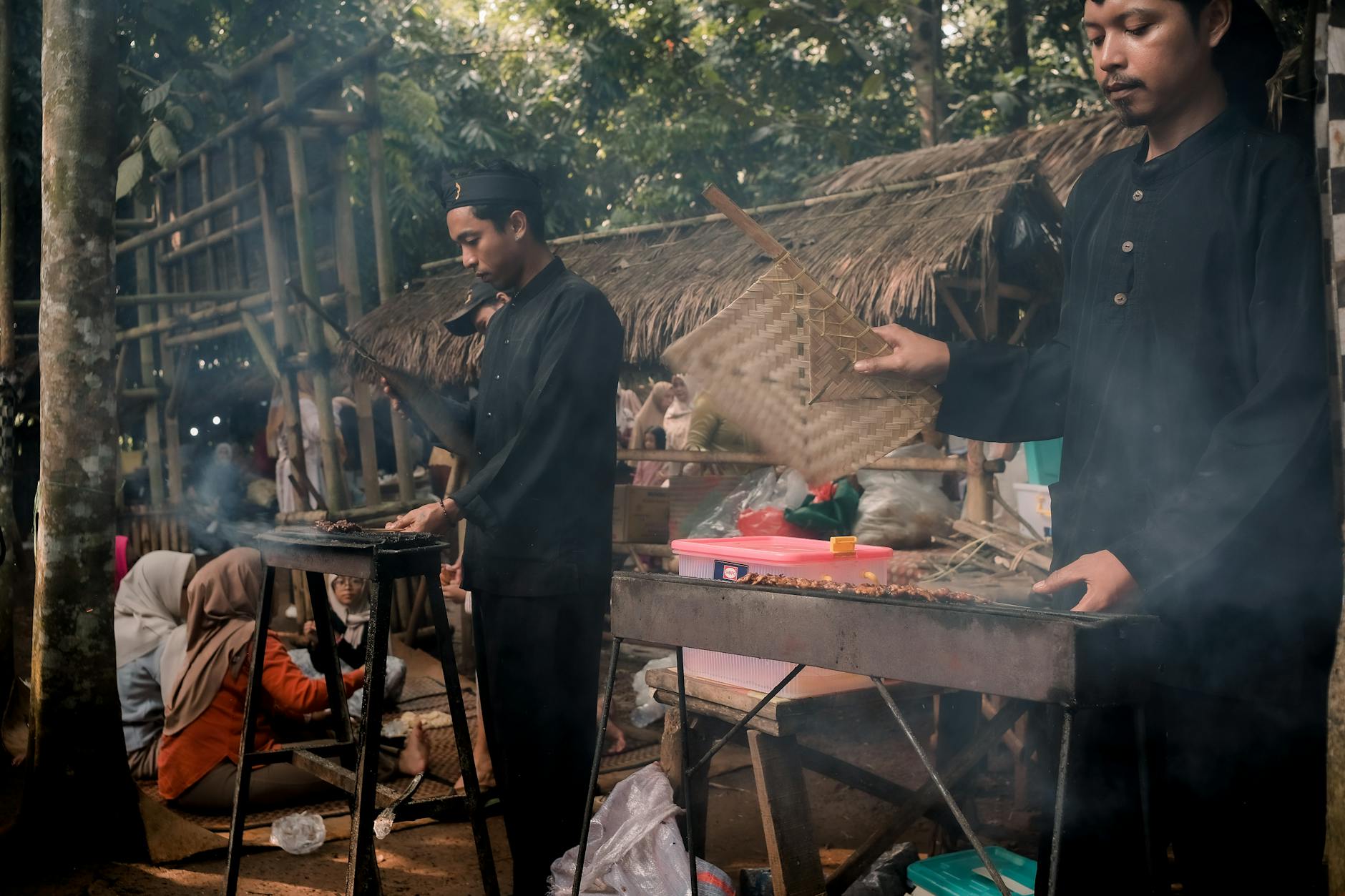 Indonesian street food vendors with grilled satay