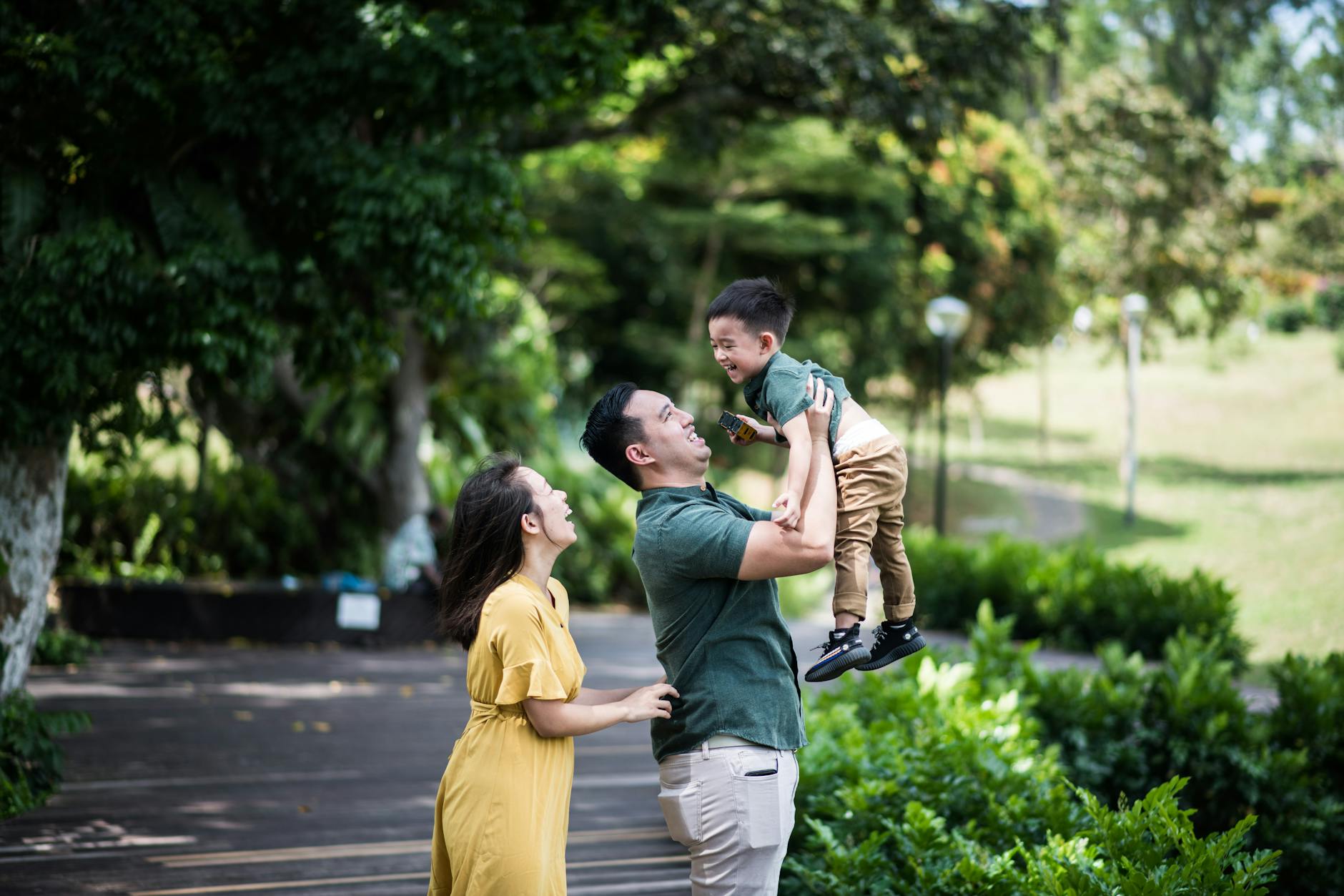 Family at urban park with children playing
