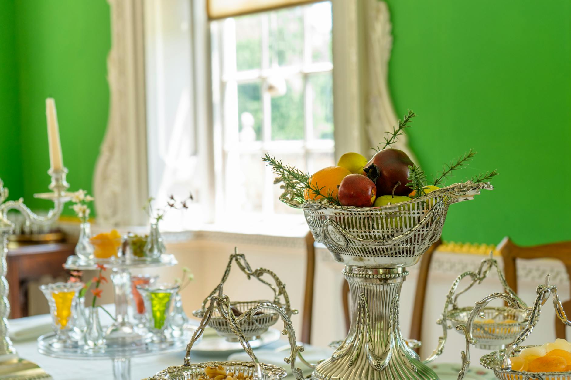 Antique-filled colonial-era hotel dining room in Jakarta