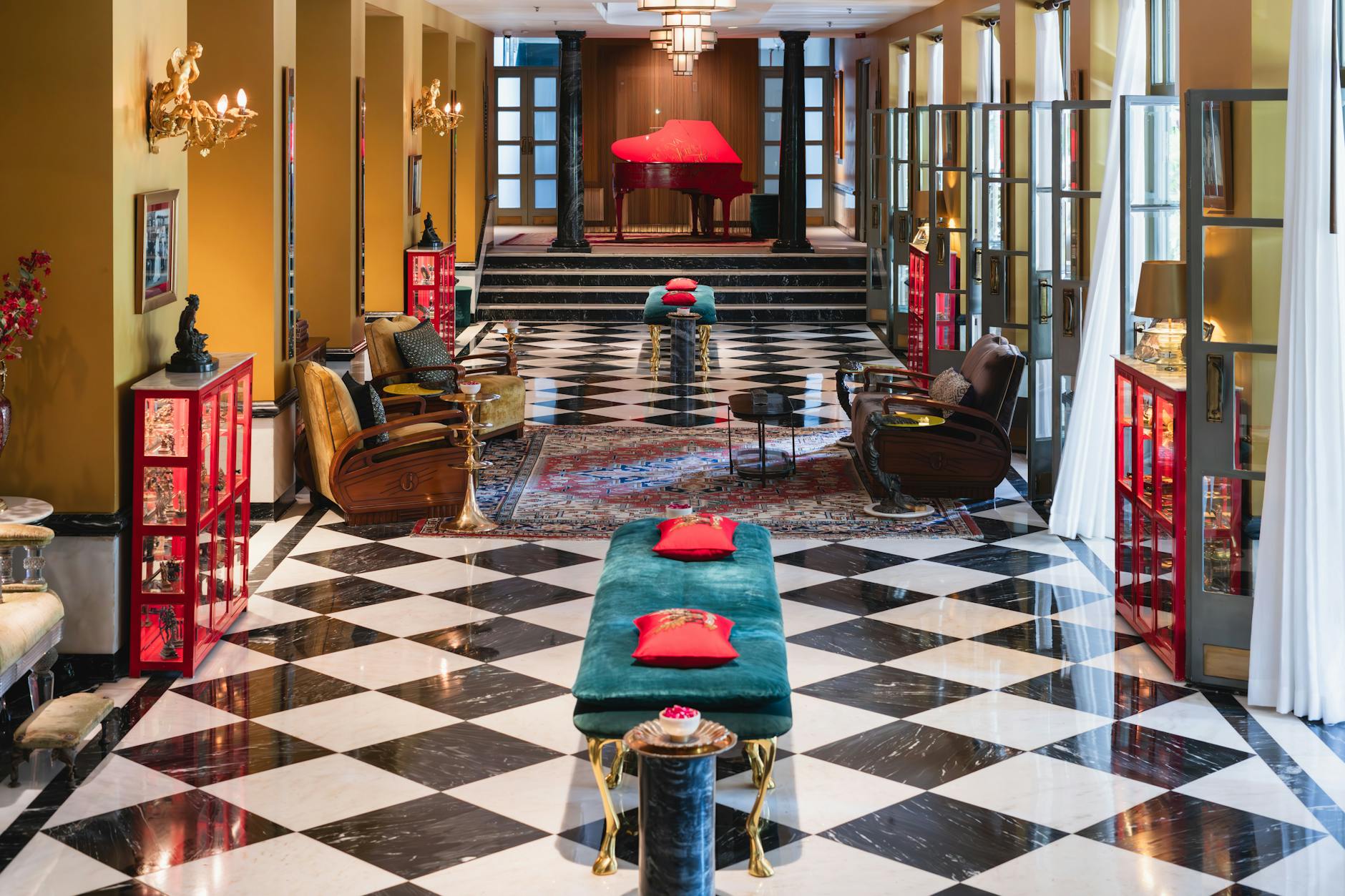 Boutique hotel lobby lounge with vintage furniture and contemporary art