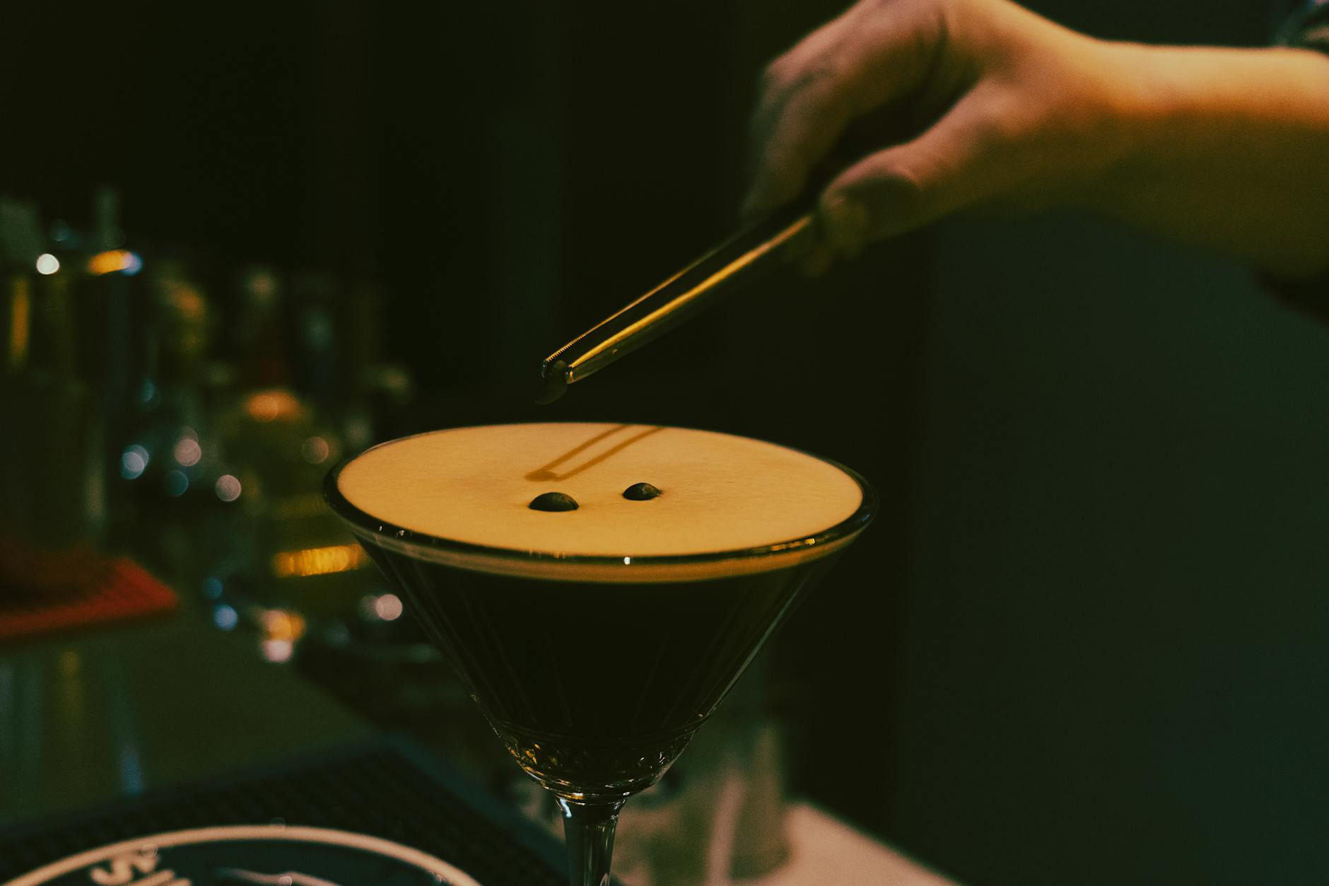 Craft cocktail bar with vintage decor and atmospheric lighting