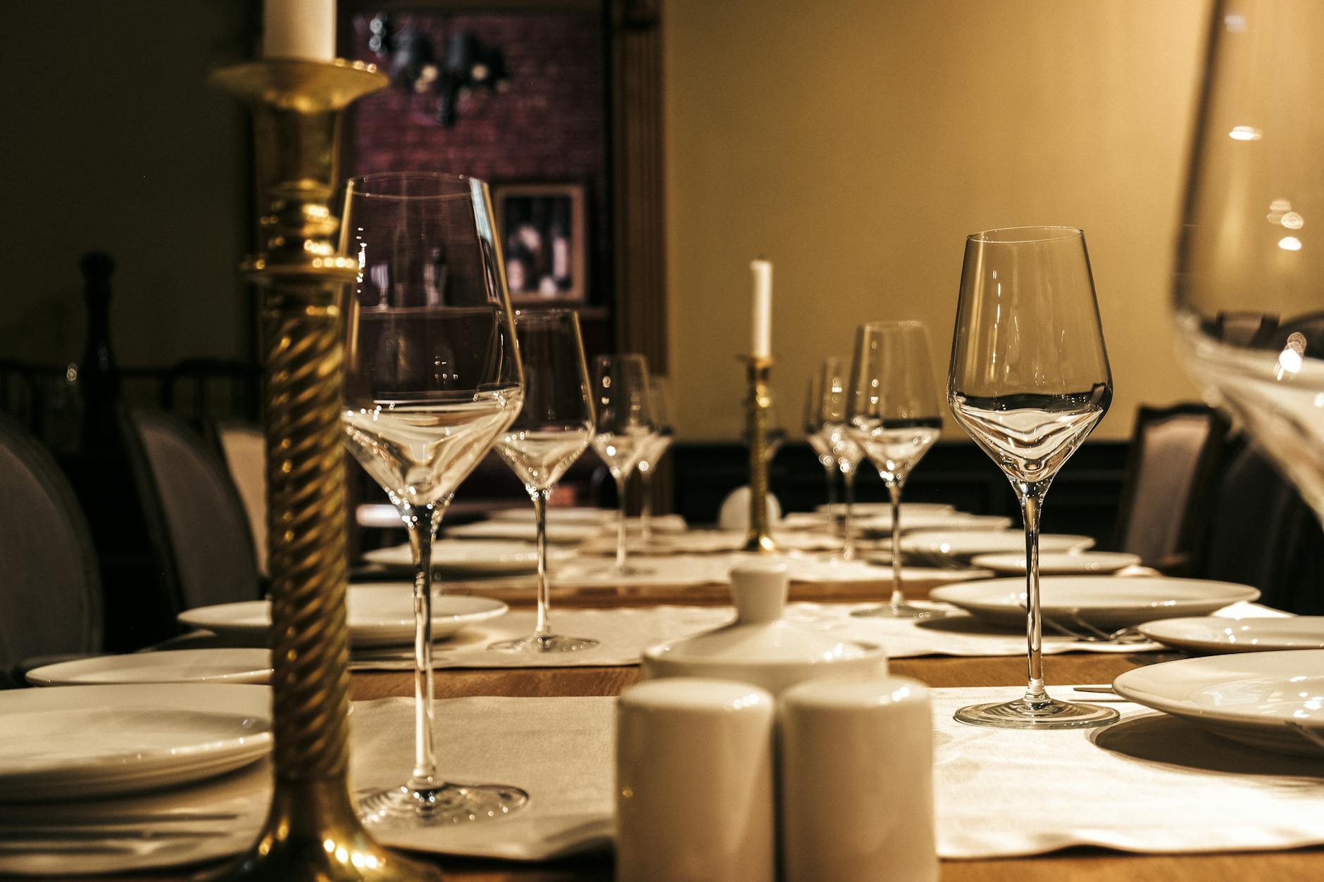 Romantic restaurant interior with candles and elegant table setting