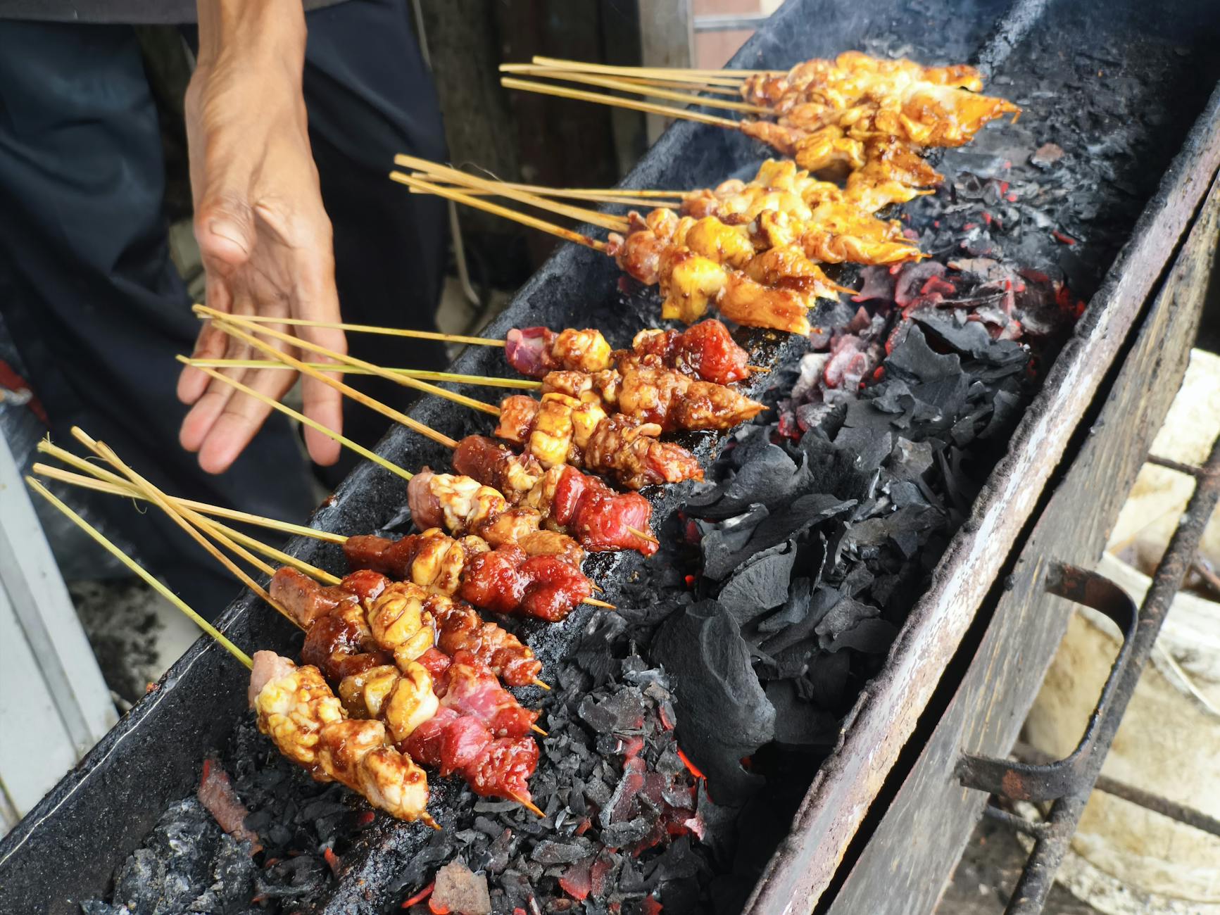 Grilled satay skewers with peanut sauce - a Jakarta food guide essential