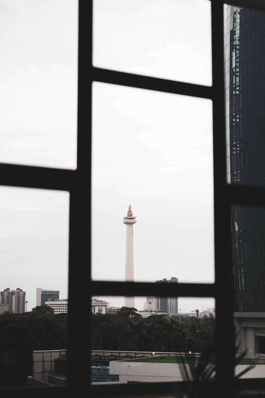 Things to do in Jakarta - visiting the iconic Monas National Monument surrounded by green parkland