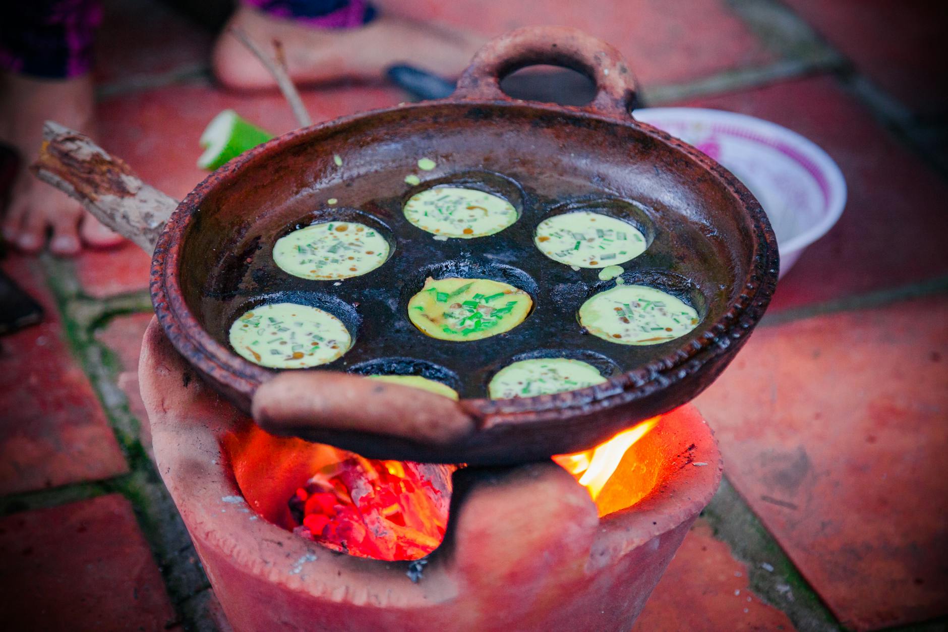 Indonesian kerak telor Betawi crepe cooking on clay pan