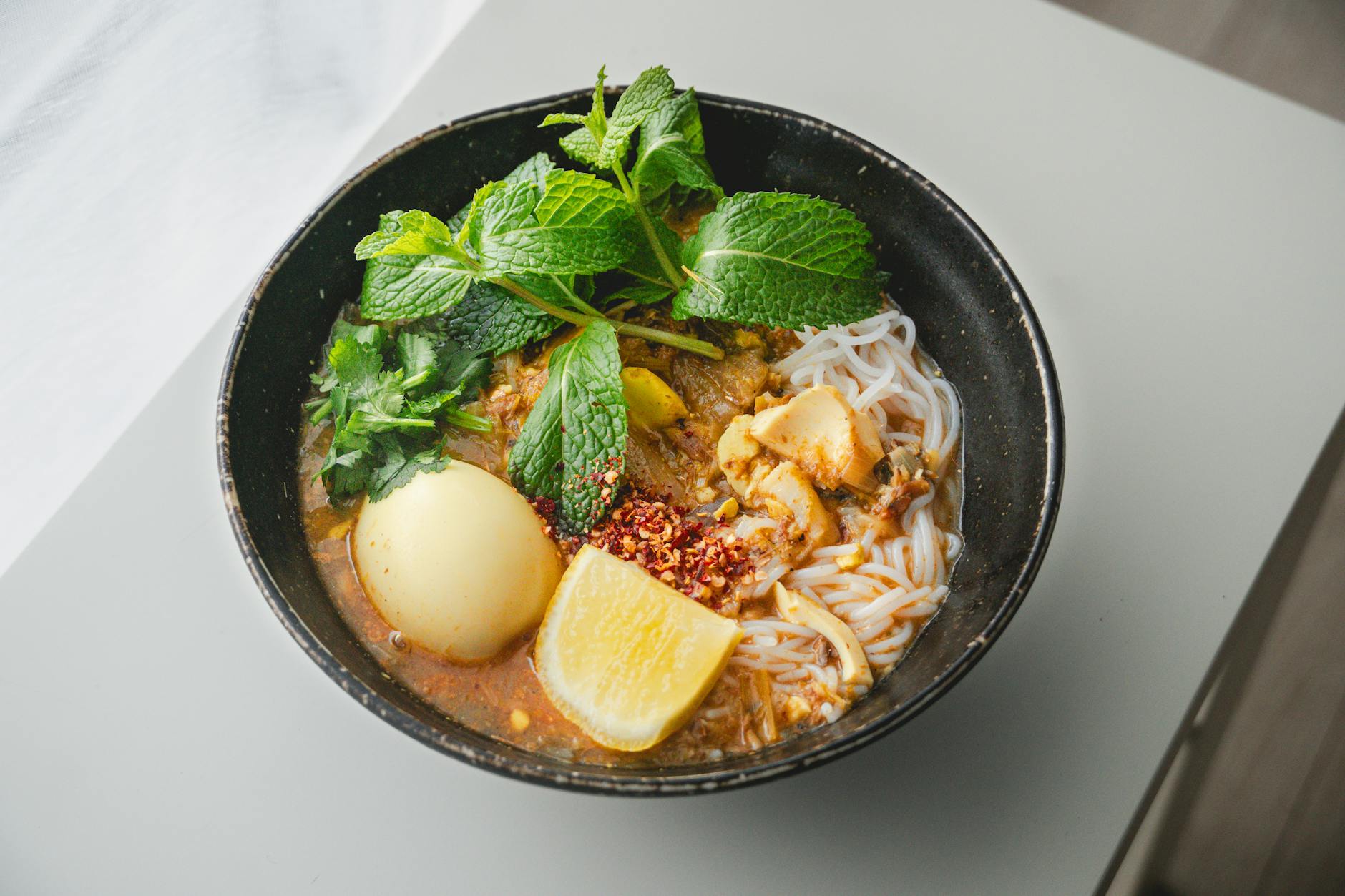 Bowl of Indonesian laksa Betawi noodle soup