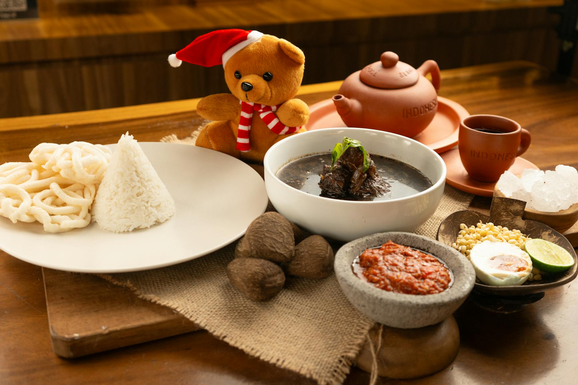 Plate of nasi uduk Indonesian coconut rice breakfast spread