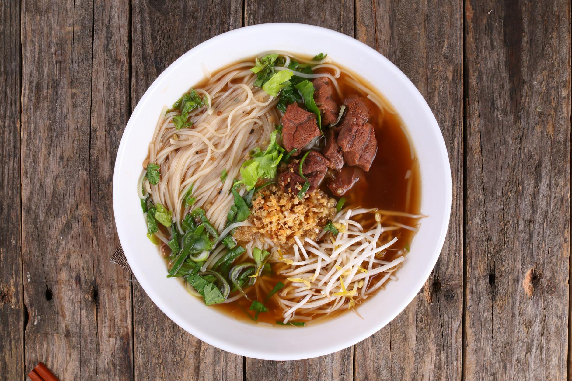 Bowl of Indonesian soup with broth and beef