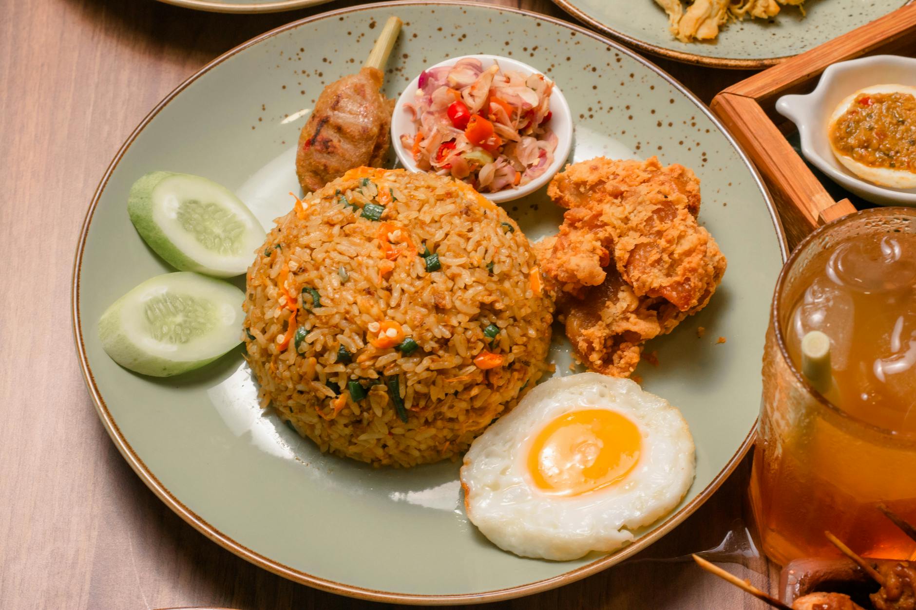 Indonesian fried chicken on plate with rice