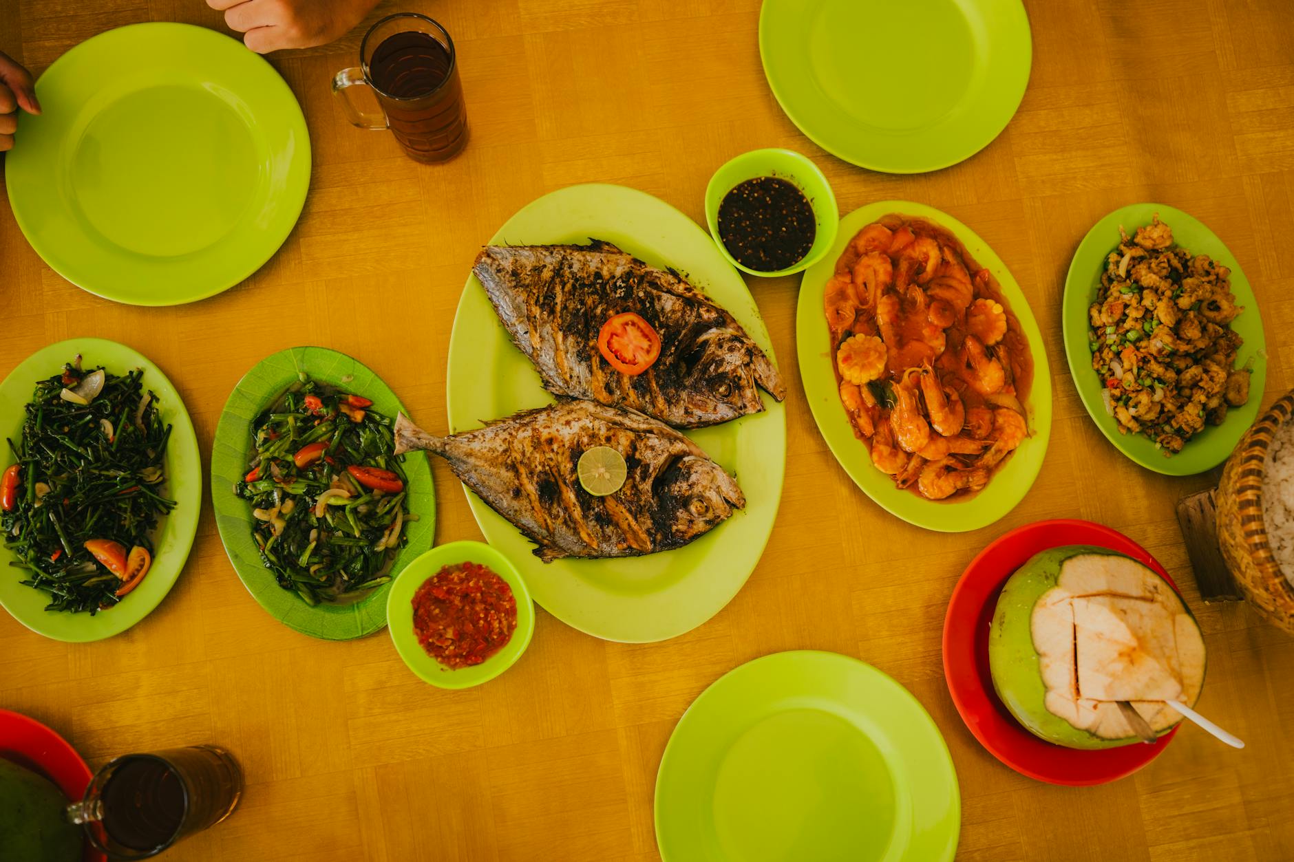 Indonesian seafood grilled fish and crab on plates