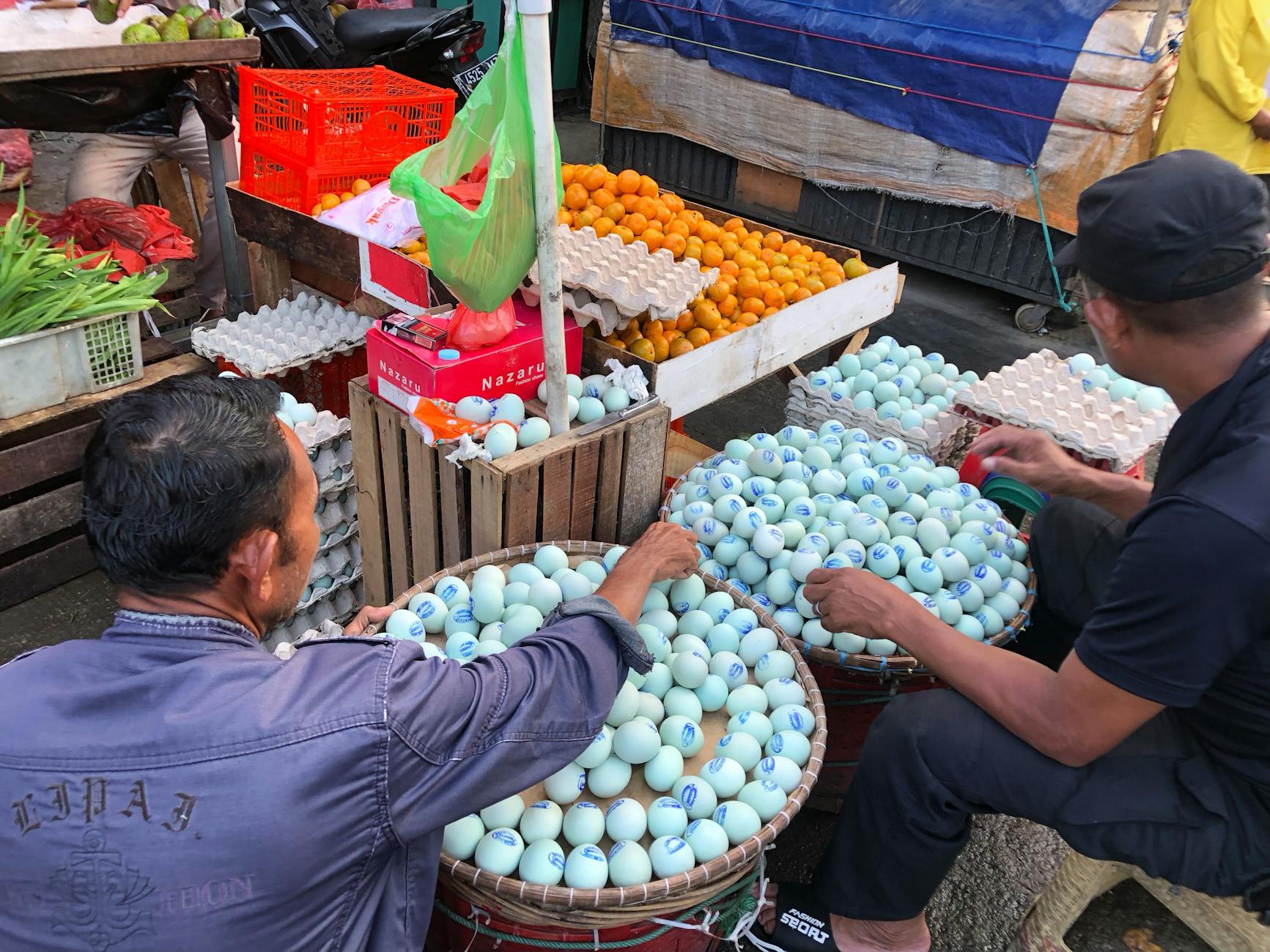 Indonesian traditional wet market with fresh produce vendors