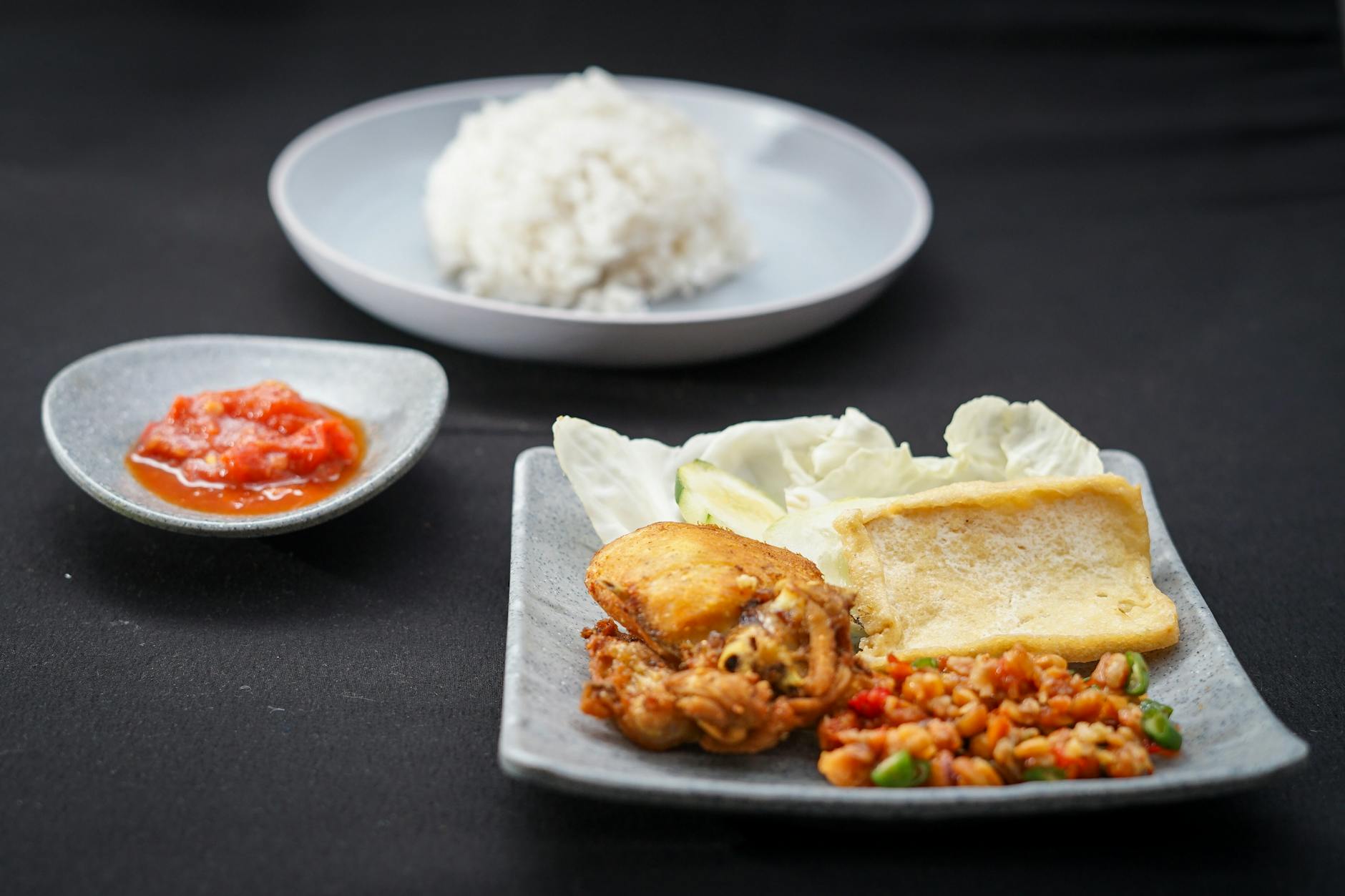 Indonesian ayam penyet smashed fried chicken with sambal