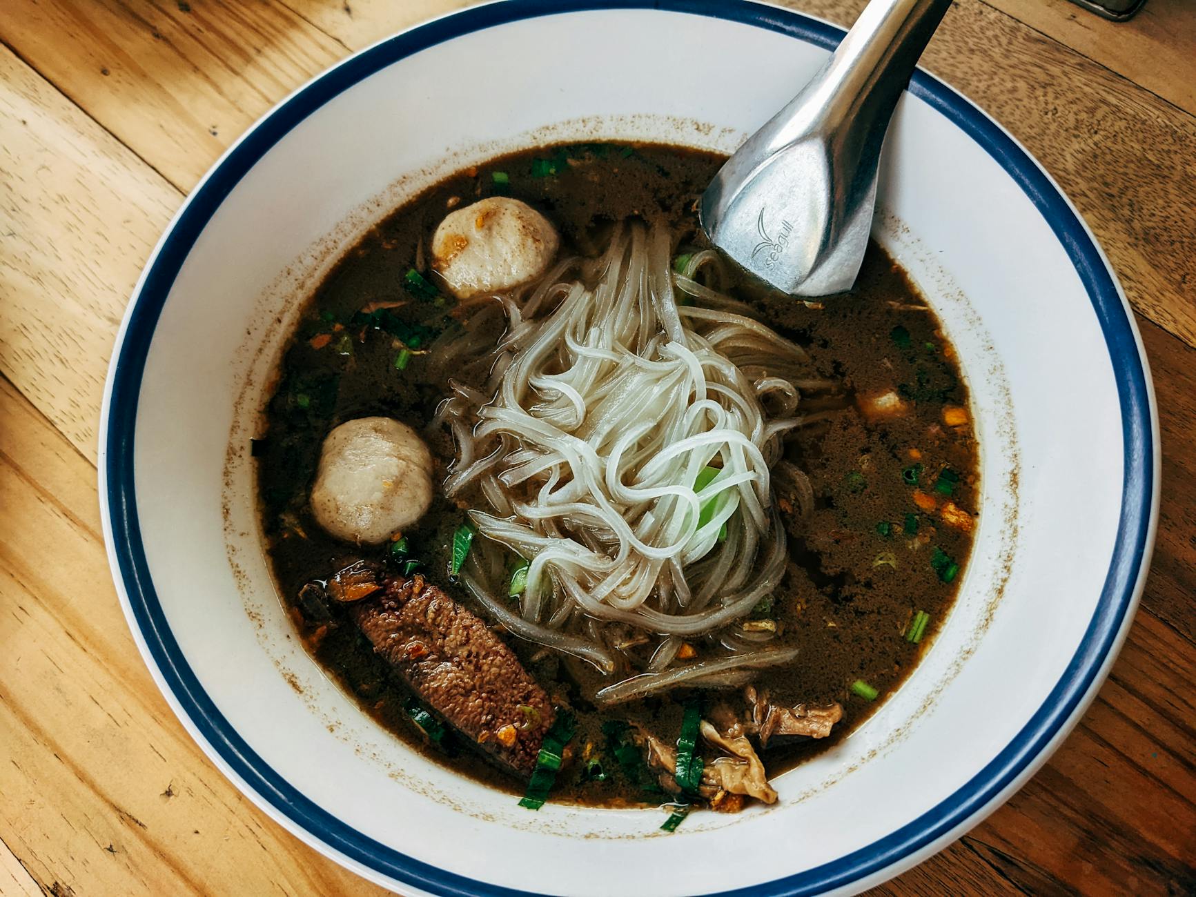 Indonesian bakso meatball soup bowl with noodles