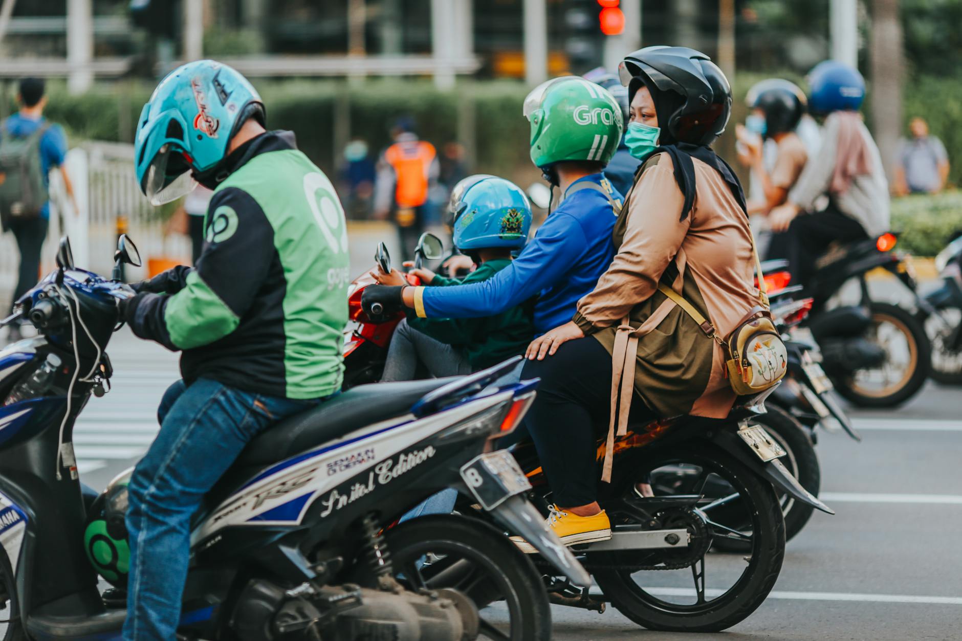 Indonesian motorbike rider city street traffic