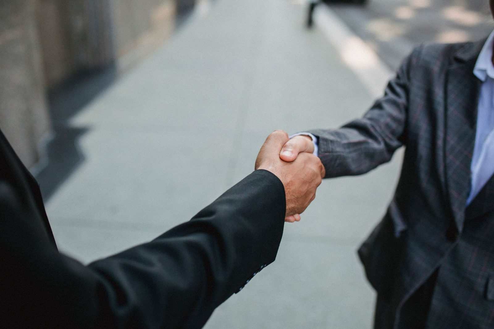 Professionals shaking hands in a Jakarta business meeting