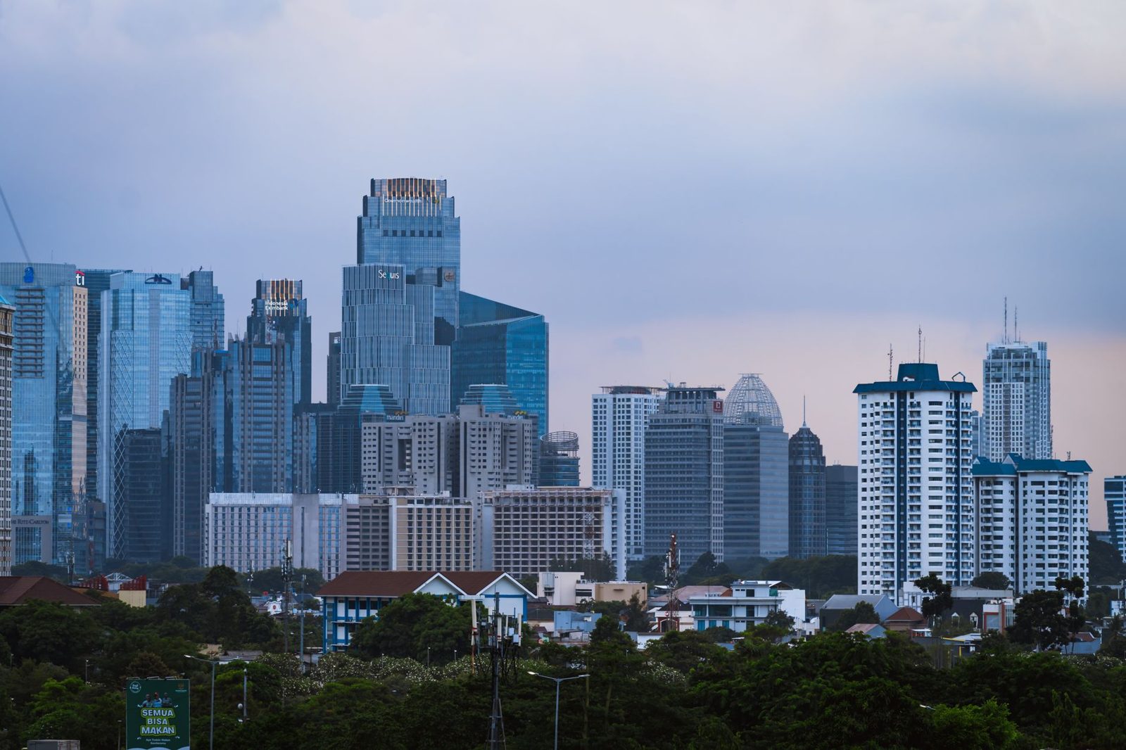 Luxury travel Jakarta skyline of SCBD high-rise towers at dusk