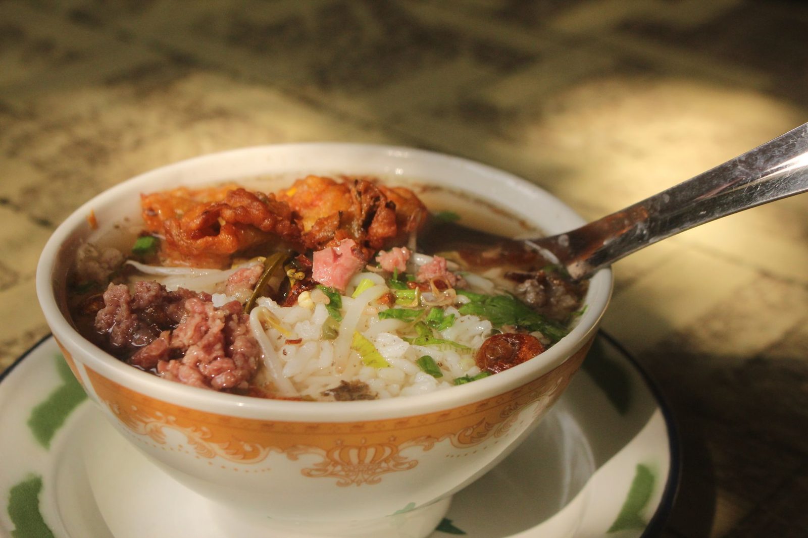 A steaming bowl of the best soto Betawi Jakarta serves, with beef and creamy broth