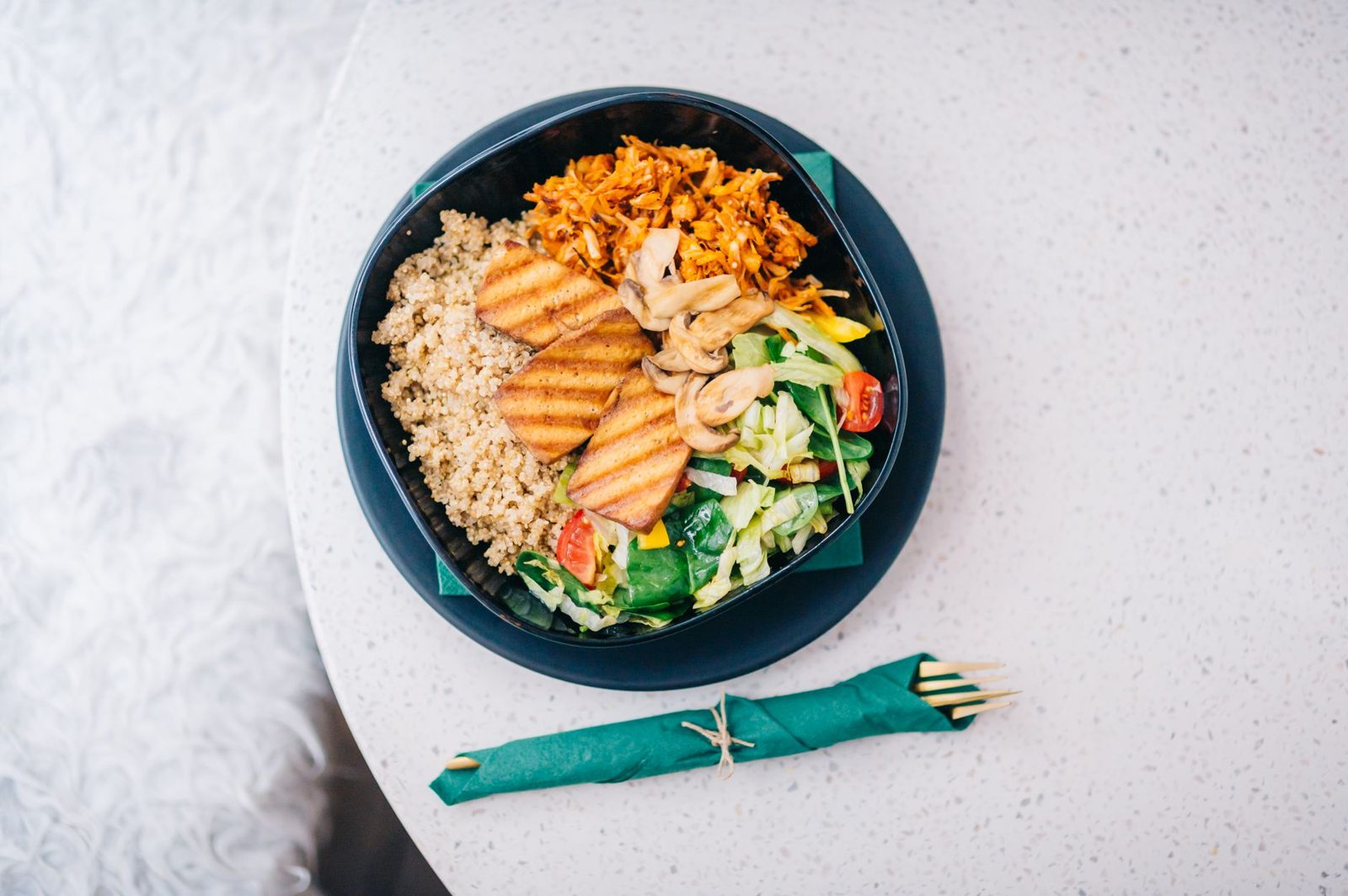 A plant-based bowl of tofu and tempeh, vegetarian food Jakarta serves widely