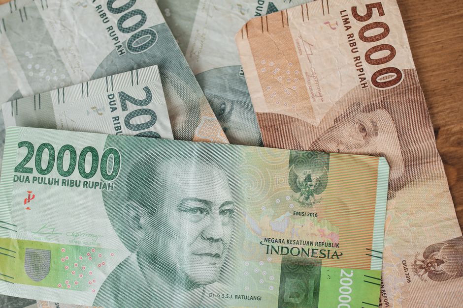 A spread of Indonesian rupiah banknotes in different denominations from 2,000 to 20,000 rupiah