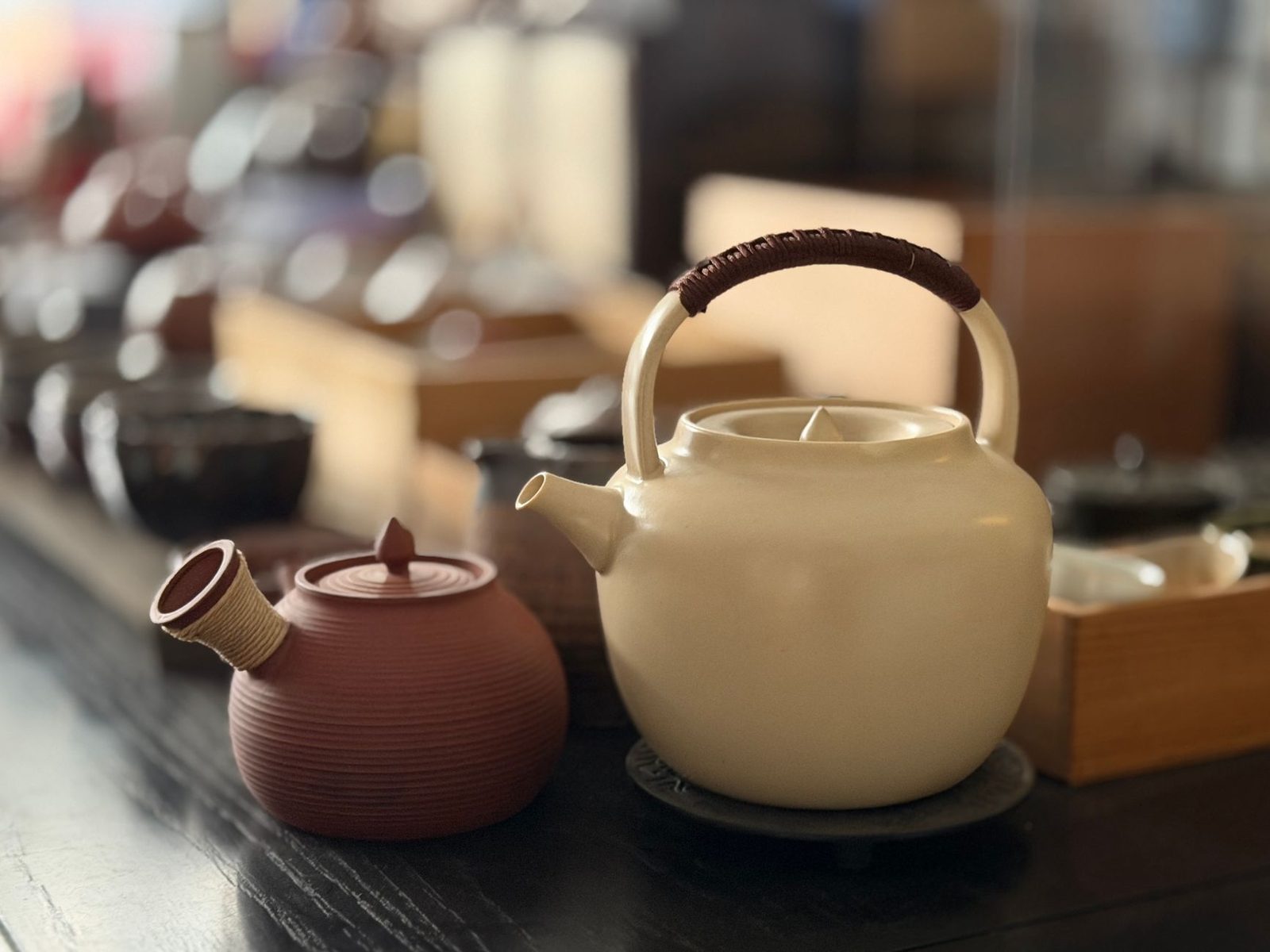 Traditional teapots set out on a counter, echoing the free-tea tradition at Pantjoran Tea House in Glodok