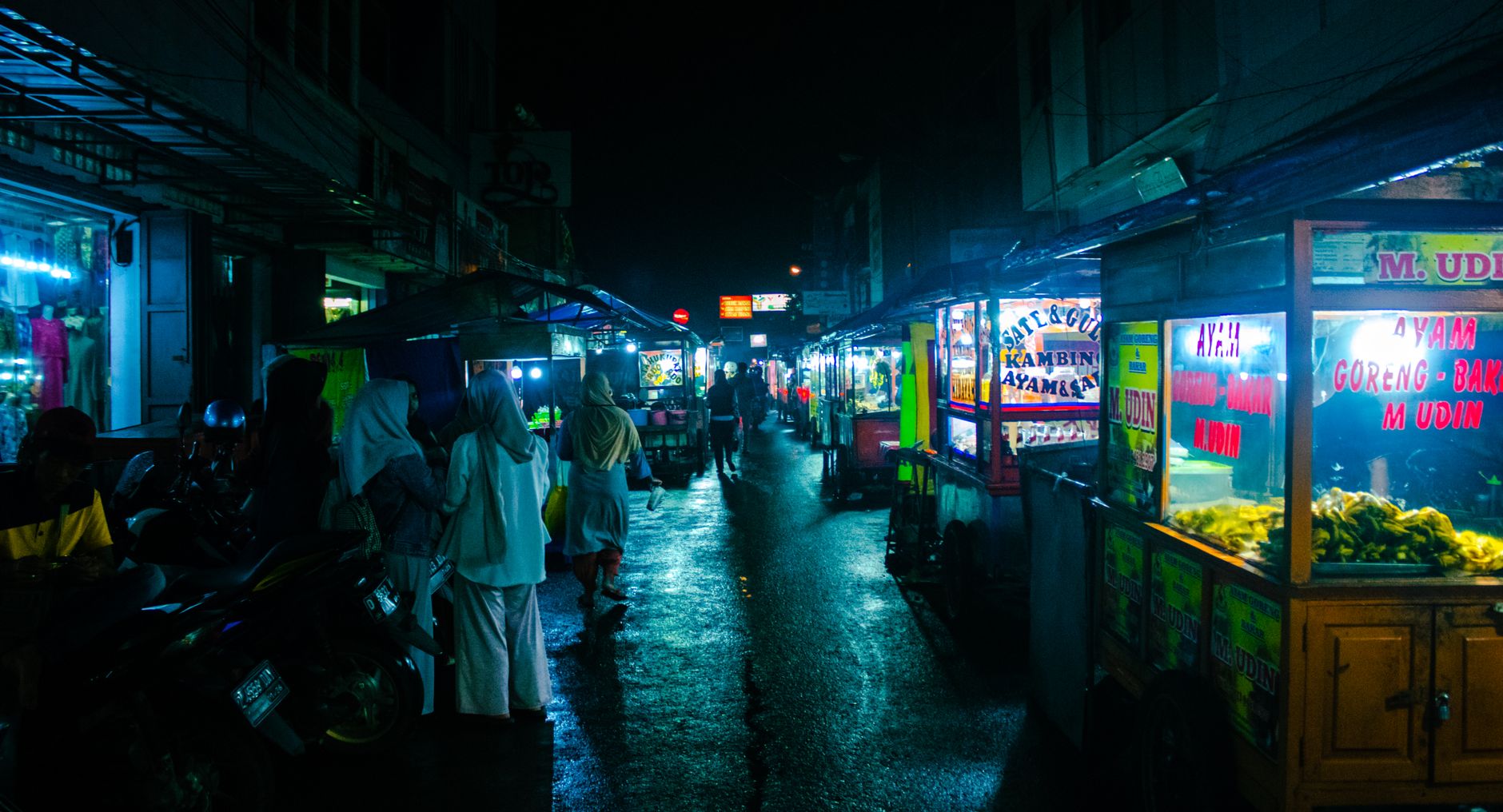 Jakarta late night eats: illuminated street food stalls trading after dark