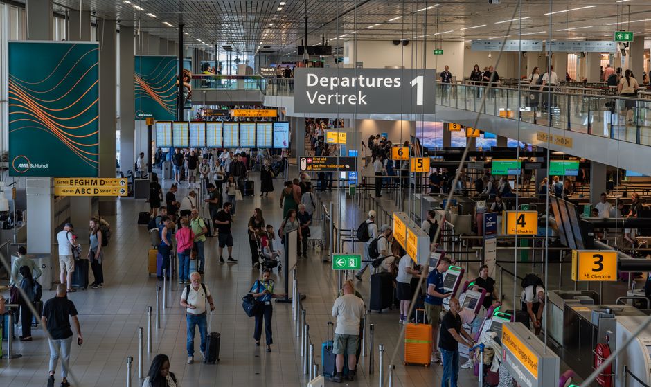 Airport departures hall crowded with travelers, relevant to trip delay and disruption cover