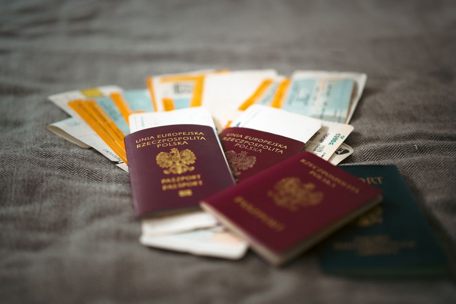Passports, boarding passes and travel documents laid out, the paperwork that should include a jakarta travel insurance policy