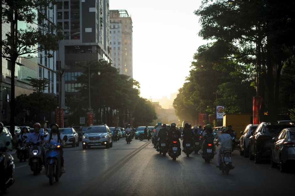 Riders on motorbikes and scooters in heavy Jakarta traffic, a common travel insurance exclusion