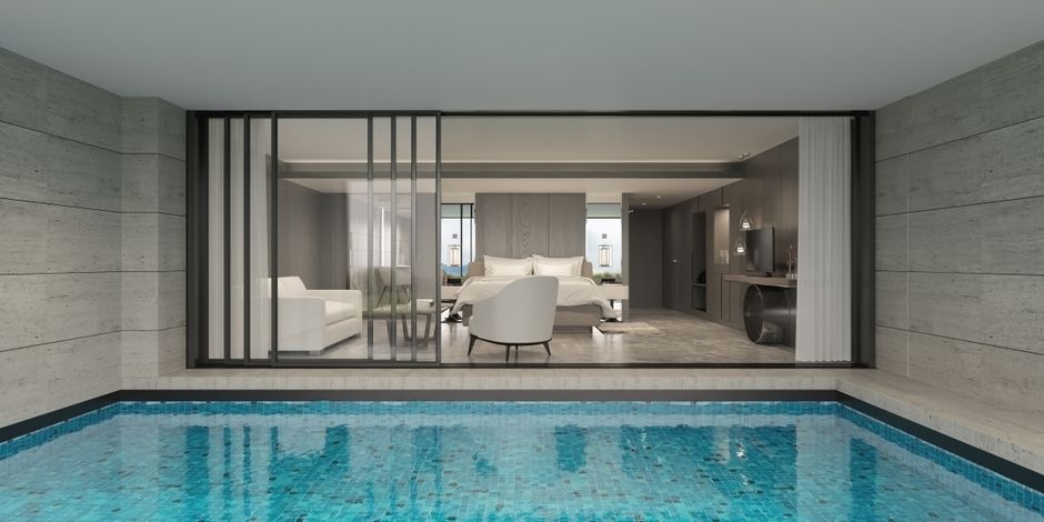 Luxury hotel room opening directly onto a private pool