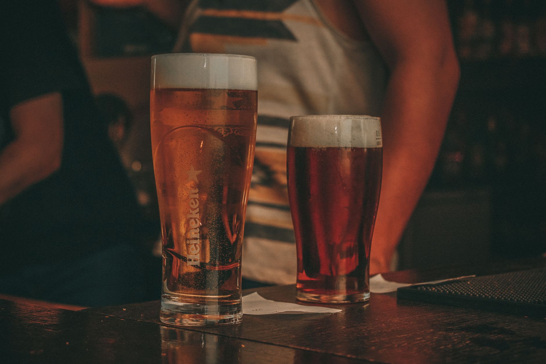 Two pints of beer on a bar counter in a Kemang Jakarta pub