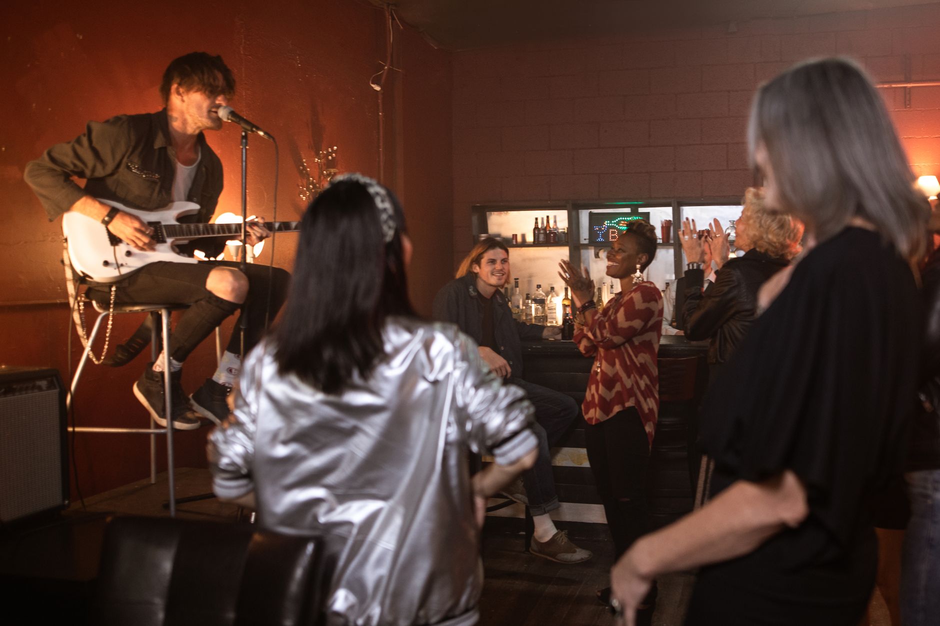 Live acoustic performance in a small bar, a staple of Kemang nightlife Jakarta