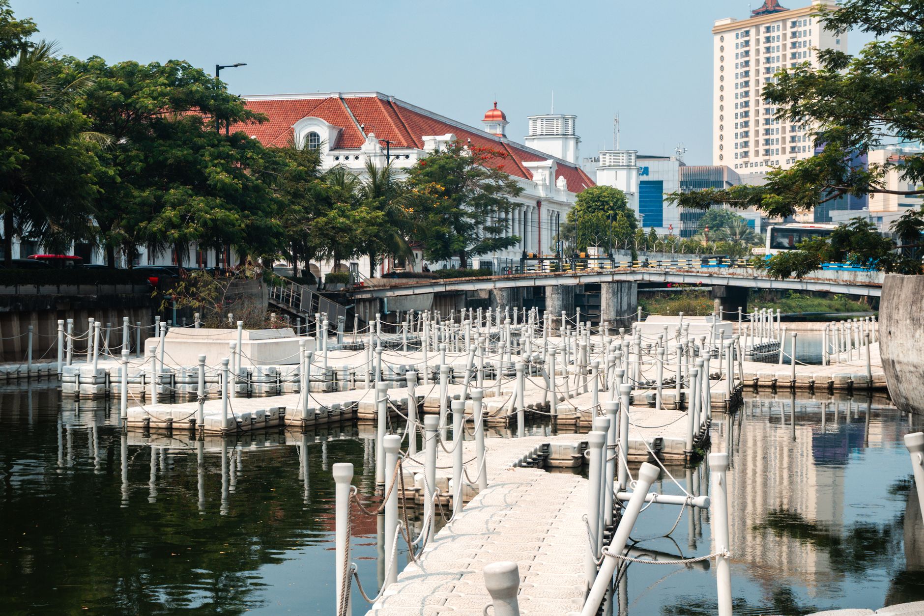 The white boardwalk promenade along the restored Kali Besar canal in Kota Tua, Jakarta